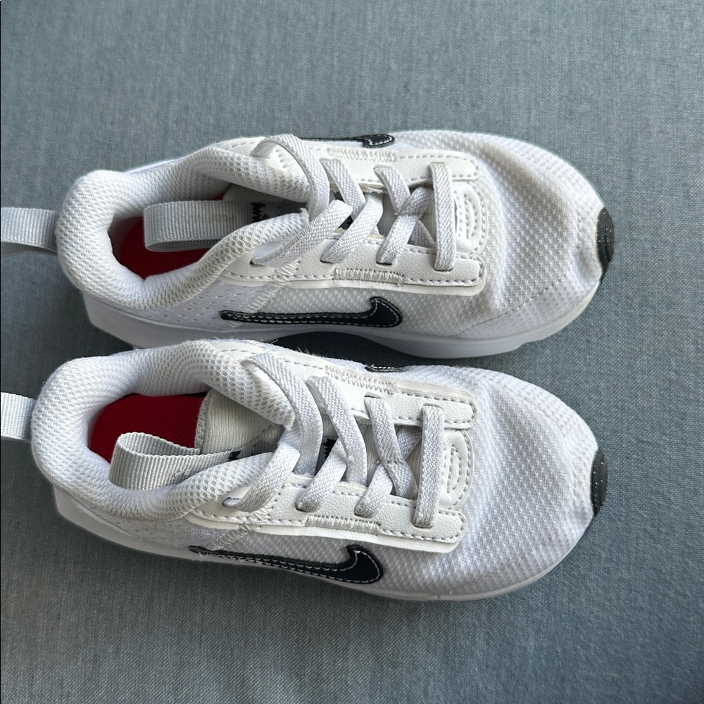 Nike White Sneakers with Black Swoosh